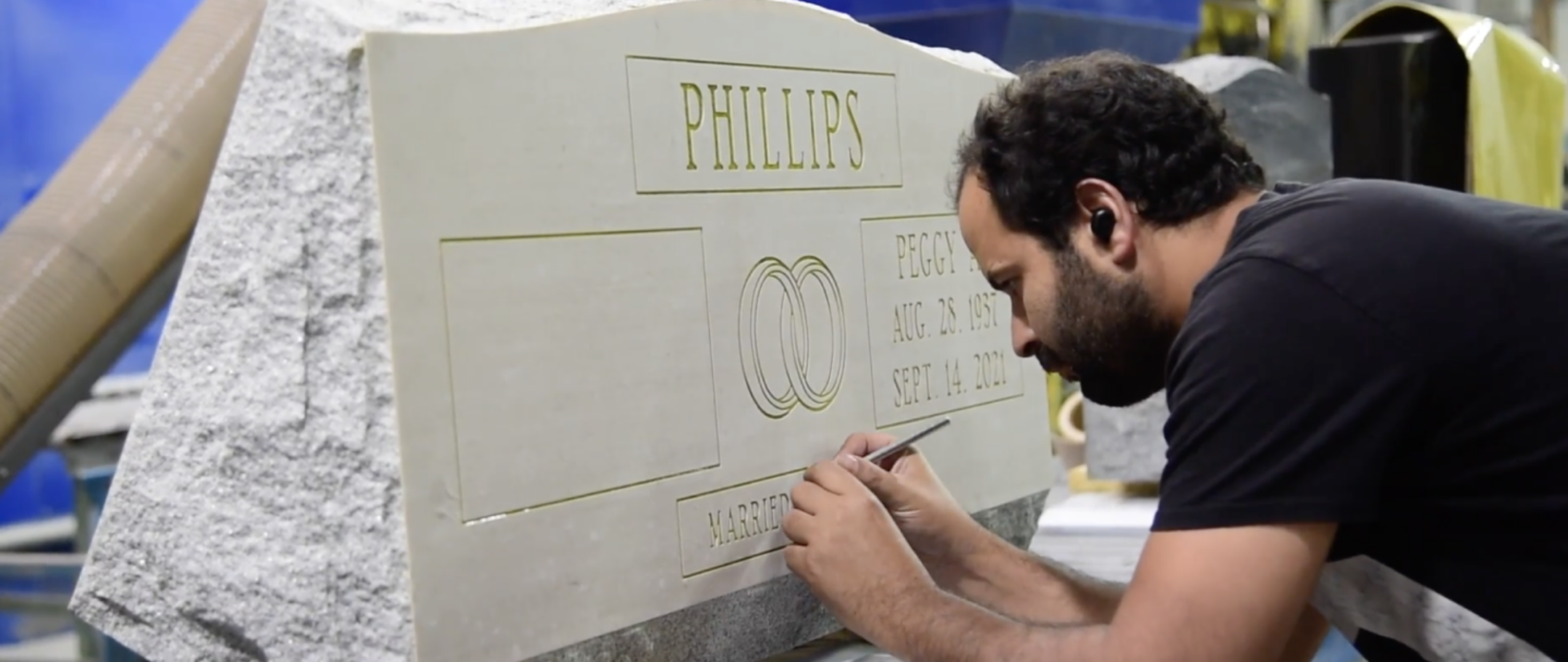 artist engraving a gravestone