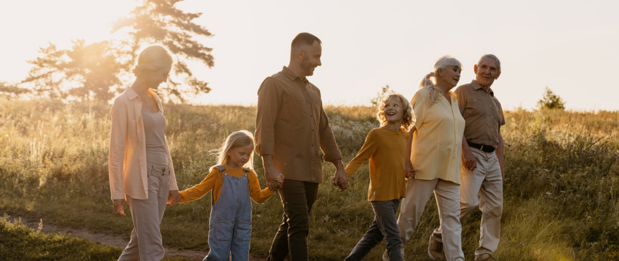 family holding hands and walking