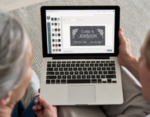 Couple reviews Salem Inspire Premier design on a laptop.