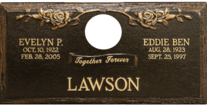 Companion bronze memorial featuring roses and epitaph.