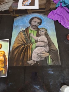 The laser etching artist used the images as a guide for coloring this laser etching of St. Joseph and baby Jesus.