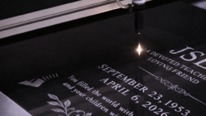 laser etching text on jet black monument.
